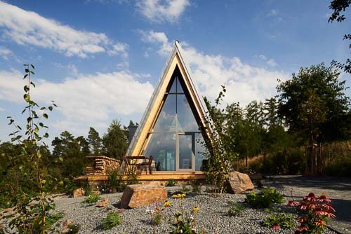 Fotografie architektury chaty u lesa. Prosklení od Thermont. Chata LUFT